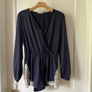 Altar'd State Outrageous Romper in navy blue with Lace detail and button closure